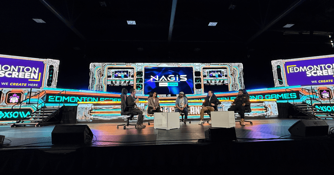 North American Game Industry Summit (NAGIS) main stage with Luke Azevedo, CEO of Edmonton Screen, moderating a panel of industry experts.