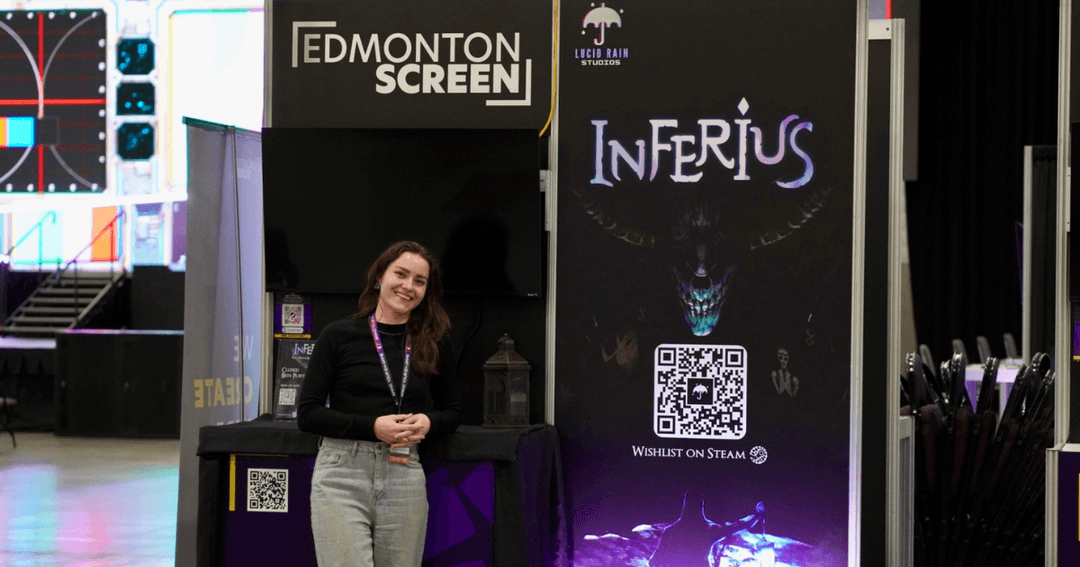 Delena Martens, co-founder of Lucid Rain Studios, smiles and poses next to the INFERIUS booth during Game Con Canada.